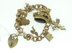 9CT YELLOW GOLD CHARM BRACELET with heart-shaped padlock and approx. eight charms, 66.1gms gross