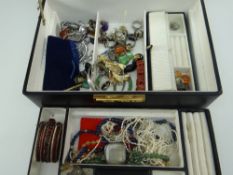 MODERN BLACK JEWELLERY BOX WITH TWO TIERS, lower tier containing a quantity of costume jewellery,