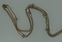 BELIEVED YELLOW GOLD & OPAL SEQUENCE LONG NECKLACE having fifteen opposing demi-sphere opals (one