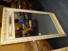 A LARGE MODERN GOLD DECORATED BEVEL WALL MIRROR in three panels, 68 x 124cms