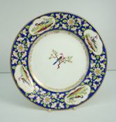 NANTGARW PORCELAIN CIRCULAR PLATE the border decorated with four panels of birds to a blue ground