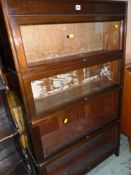 VINTAGE LIBRARY BOOKCASE having four shelves individually glazed with letter-box movement, 87cms