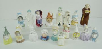 COLLECTION OF SEVENTEEN ROYAL WORCESTER PORCELAIN CHARACTER CANDLE SNUFFERS including Punch, Toby,