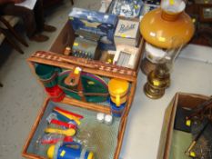 MODERN BASKET PICNIC HAMPER, two oil lamps and a box of vintage toys including toy Codec till