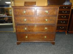 19TH CENTURY OAK CHEST OF THREE LONG AND TWO SHORT DRAWERS on carved bracket feet and with brass