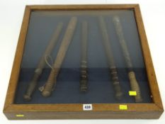 FRAMED DISPLAY OF FIVE VINTAGE POLICE TRUNCHEONS including nineteenth century painted example (