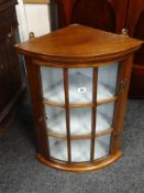 ANTIQUE REPRODUCTION BOW FRONT GLAZED HANGING CORNER CABINET