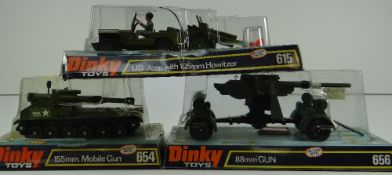 THREE DINKY TOYS MILITARY MODELS comprising US Jeep with 105mm Howitzer number 615, 155mm Mobile GUN