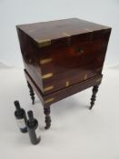 REGENCY ROSEWOOD BRASS BOUND WINE COOLER ON STAND with twin brass carry handles, the interior with