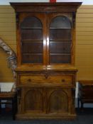 EARLY VICTORIAN MAHOGANY SECRETAIRE BOOKCASE having a two door cupboard base with arched panels