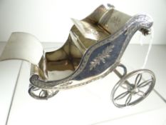 EPNS MODEL OF AN EDWARDIAN BATH-CHAIR with bright cut floral decoration, believed to be in the