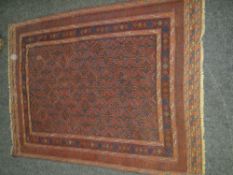 MAINLY BLUE & RED GROUND PERSIAN WOOLEN RUG with geometric design, diamond shaped centre panel,
