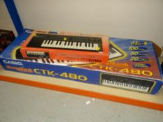 A BOXED CASIO CTK-480 ELECTRIC PIANO together with a Yamaha keyboard