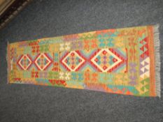 VEGETABLE DYED WOOL CHOBI KELIM RUNNER in multi-coloured geometric pattern, 205 x 62cms