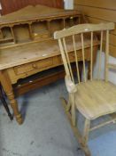 PINE TWO-DRAWER DESK with pigeon hole upper shelving, together with a stripped pine rocking chair