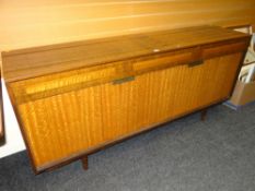 MID-CENTURY LEBUS POLISHED SIDEBOARD having three drawers over two concertina doors with cocktail