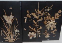 SET OF THREE JAPANESE MEIJI PERIOD IVORY AND BONE COLLAGES, floral studies on black lacquer