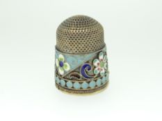 EASTERN EUROPEAN SILVER GILT & CLOISSONE THIMBLE having a multi-coloured band of flowers and