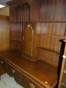 GOOD VINTAGE REGENCY-STYLE OAK DRESSER with cupboard to the centre of the shelving, open three-