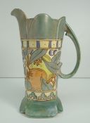 BURSLEY WARE CHARLOTTE RHEAD JUG decorated with band of fruit and flowers and with scrolling loop