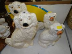 TWO PAIRS OF GILDED STAFFORDSHIRE SEATED SPANIELS