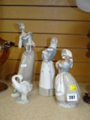 THREE LLADRO FIGURINES, together with a Nao similar