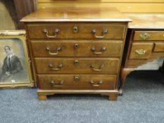 GOOD CHEST OF DRAWERS composed of four graduated long drawers on bracket feet, brass swan-neck
