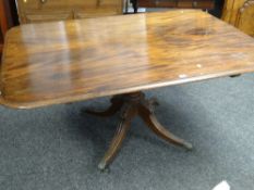 ANTIQUE MAHOGANY ROUNDED RECTANGULAR TEA TABLE on four carved and reeded spider supports with