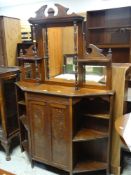 VINTAGE MAHOGANY MIRROR BACK CABINET with galleried top, two door cupboard base flanked by shelves