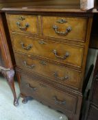 QUALITY ANTIQUE REPRODUCTION CHEST having three graduated drawers, furnished with carved handles and