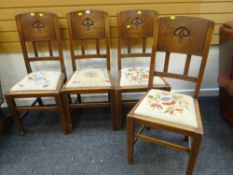 SET OF FOUR MATCHING OAK HIGH BACKED ART NOUVEAU STYLE DECORATED DINING CHAIRS with drop in seats