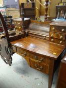 MAHOGANY BOW FRONT KNEEHOLE DESK with shelves to the top, together with a shield-back hall chair (