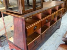 VINTAGE DRAPERY / HABERDASHERS DISPLAY COUNTER with eight wooden tray-drawers to the back, 178cms