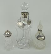 GLASS DECANTER WITH SILVER COLLAR of waisted form with hobnail-cut stopper, together with three