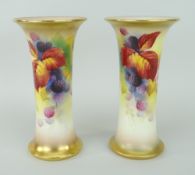 PAIR OF ROYAL WORCESTER PORCELAIN VASES having flared necks and flared bases, decorated with