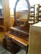 REPRODUCTION DARK WOOD DRESSING TABLE together with a large oval dressing mirror and drawers, 195cms