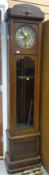 MID-TWENTIETH CENTURY OAK LONGCASE CLOCK with circular dial, brass centre plate