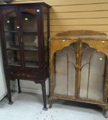 TWO VINTAGE DISPLAY CABINETS one on raised feet with a centre drawer