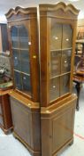 PAIR OF REPRODUCTION MAHOGANY STANDING CORNER CABINETS with glazed and shelved top, cupboard base,