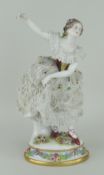 PORCELAIN LACEWORK FEMALE DANCER FIGURE in elaborate dress on an oval floral encrusted base, 31cms