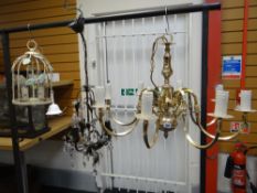 AN EIGHT ARM BRASS CEILING LIGHT together with two other leaf decorated ceiling lights