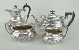 EARLY TWENTIETH CENTURY FOUR-PIECE SILVER MATCHING TEASET comprising teapot, sucrier, cream jug,