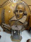LARGE CIRCULAR WALL PLAQUE DEPICTING WILLIAM SHAKESPEARE together with a small brass effect metal