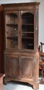 ANTIQUE OAK STANDING CORNER CUPBOARD with two-door glazed top and two-door cupboard base