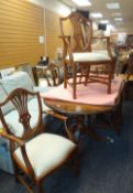 A REPRODUCTION MAHOGANY TWIN PEDESTAL EXTENDING DINING TABLE together with six matching wheatsheaf
