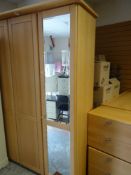 MODERN LIGHTWOOD BEDROOM SUITE comprising large four-door wardrobe centre doors flanked by