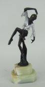 ART DECO PAINTED BRONZE SCULPTURE OF A FEMALE DANCER with silver dress-top raised over a stepped