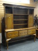 GOOD ANTIQUE OAK DRESSER with a three shelf top flanked with cupboards with an open three drawer