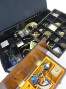 COSTUME JEWELLERY in a black plastic container containing cuff links, brooches, necklaces ETC and