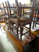 GOOD MAHOGANY DROP LEAF GATE LEG DINING TABLE with turned legs and castors together with four oak c